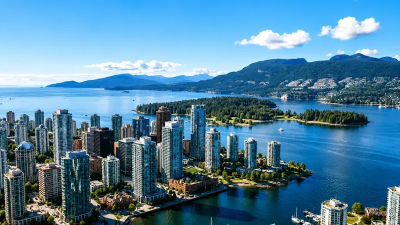 Vancouver skyline and Pacific coastline with forested islands from above